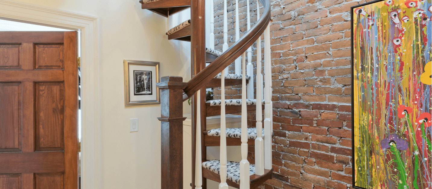 Wooden Spiral Staircase with carpet treads