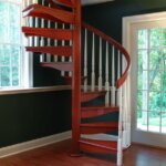 Traditional Home with dark, painted Wood Staircase