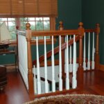 Traditional Home with dark, painted Wood Staircase