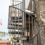 Suburban Waterfront Home with Steel Balcony Stair