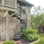 Suburban Waterfront Home with Steel Balcony Stair