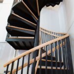 Dual Rail Black Steel Staircase with Wood Accents