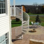 Country Patio with White Outdoor Spiral Stair