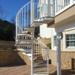 Country Patio with White Outdoor Spiral Stair