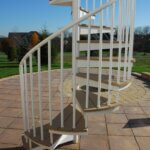 Country Patio with White Outdoor Spiral Stair