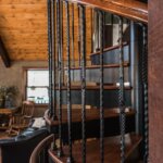 Rustic Home with Decorative, Wrought Iron Spiral Stair