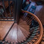 Rustic Home with Decorative, Wrought Iron Spiral Stair