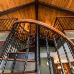 Rustic Home with Decorative, Wrought Iron Spiral Stair