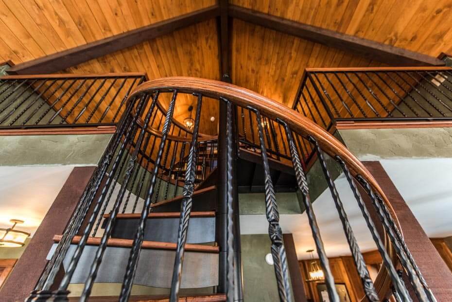 Rustic Home with Decorative, Wrought Iron Spiral Stair