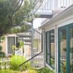 Suburban Home with Galvanized Roof Deck Staircase