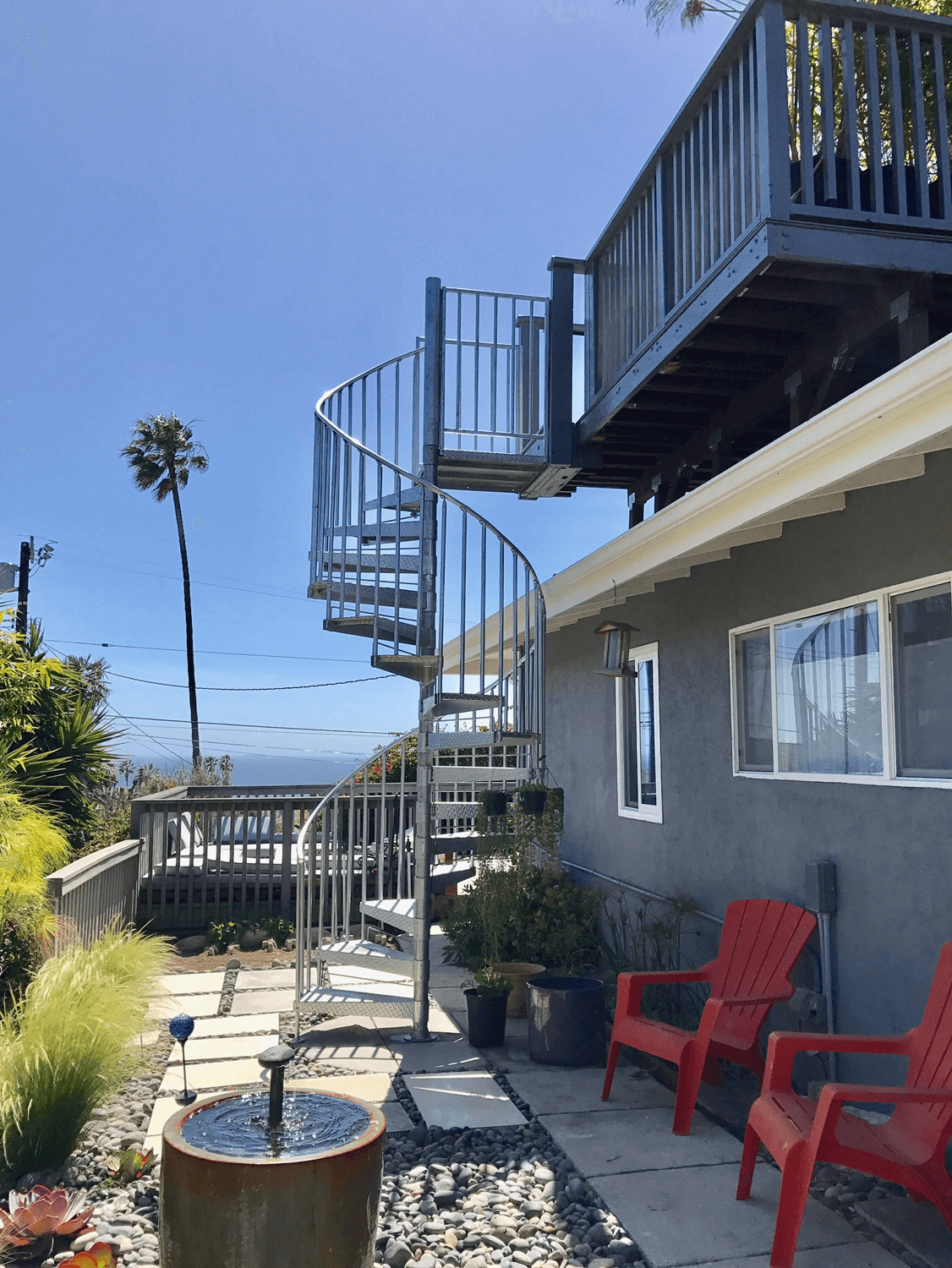 outdoor spiral staircase to balcony