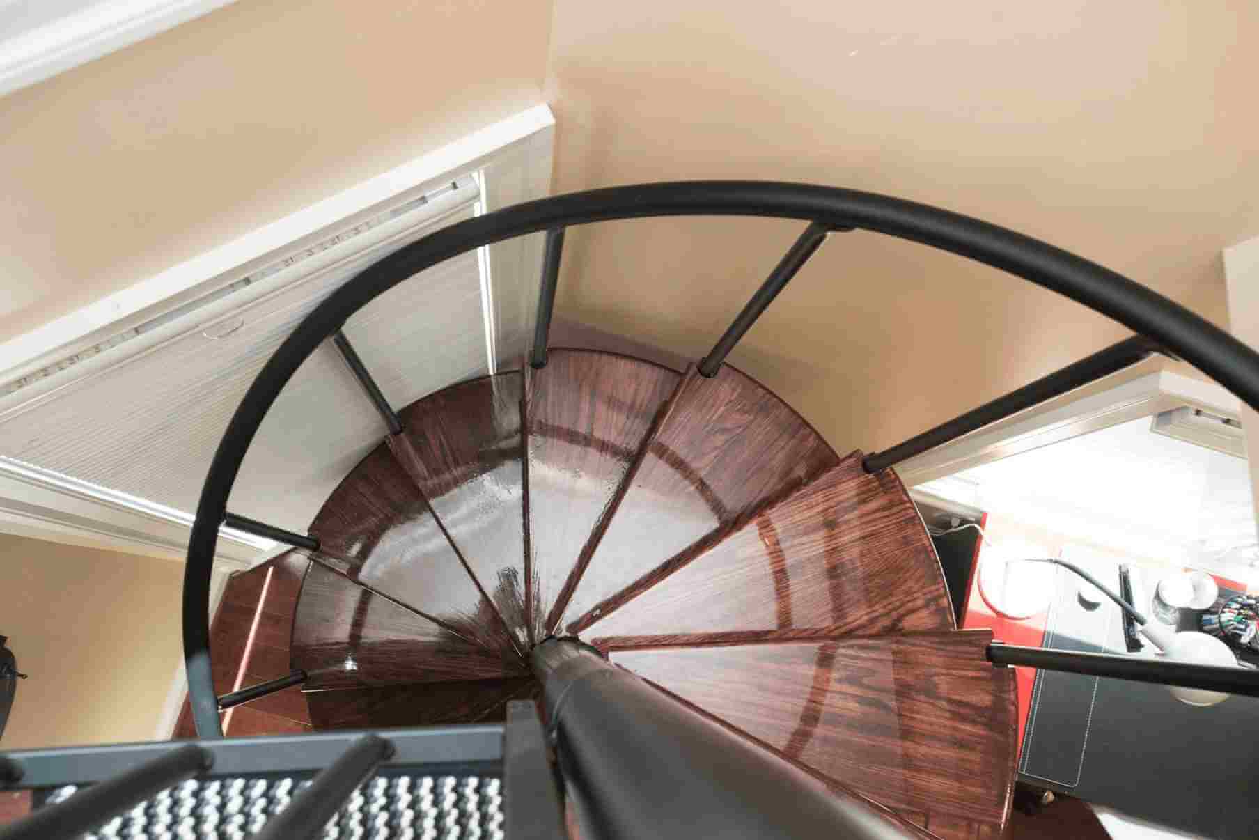 dark-stained-wood-treads-on-steel-spiral-stair_11zon