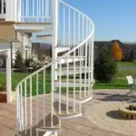 Country Patio with White Outdoor Spiral Stair